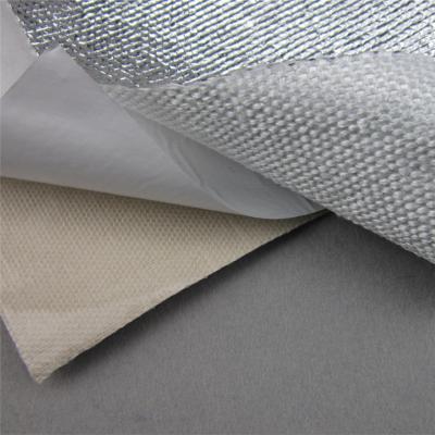 Heat shield barrier with adhesive