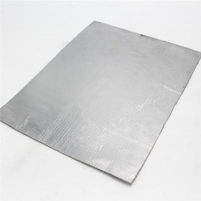 Heat shield barrier with adhesive